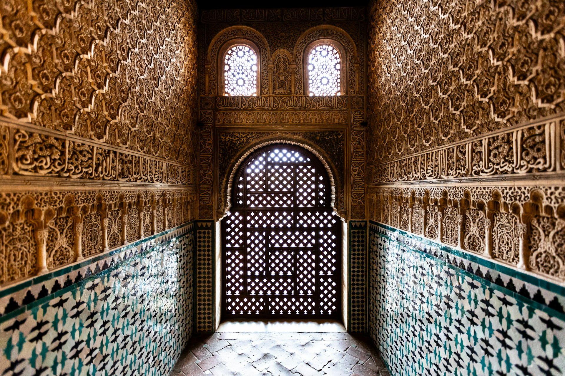 A long hallway with a door and a window